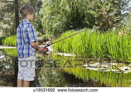 Little boy fishing at lake View Large Photo Image Stock Image - Little boy fishing at lake. Fotosearch