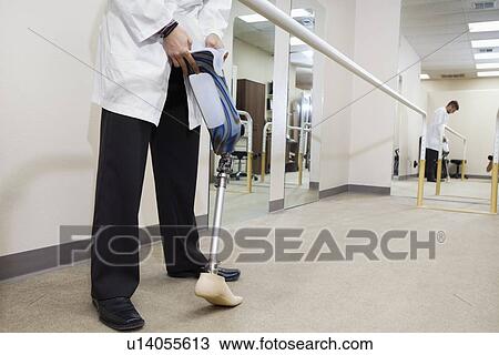Low section of technician with advanced prosthetic foot View Large Photo Image Stock Image - Low section of technician with advanced prosthetic foot. Fotosearch