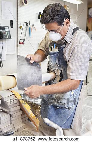 Mature male worker polishing prosthetic limb in workshop View Large Photo Image Stock Image - Mature male worker polishing prosthetic limb in workshop. Fotosearch