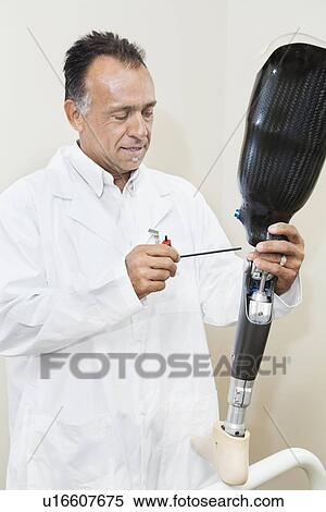 Mature technician working on prosthetic foot View Large Photo Image Stock Photography - Mature technician working on prosthetic foot. Fotosearch