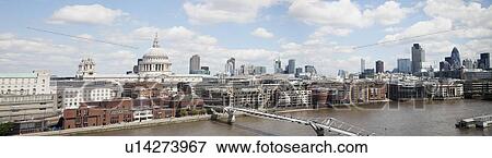 Stock Photo - Millennium bridge over River Thames and cityscape, London, England, UK. Fotosearch