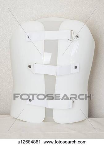 Stock Image - Plastic upper limb prosthesis against gray background. Fotosearch