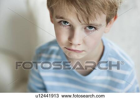 Portrait of a sad young boy View Large Photo Image Stock Image - Portrait of a sad young boy. Fotosearch