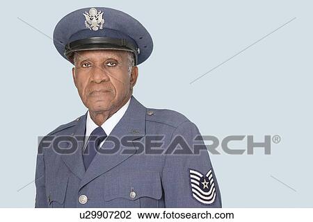 Stock Image - Portrait of a senior male US Air Force officer over light blue background. Fotosearch