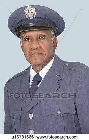 Portrait of a senior male US Air Force officer over light blue background View Large Photo Image Stock Photograph - Portrait of a senior male US Air Force officer over light blue background. Fotosearch