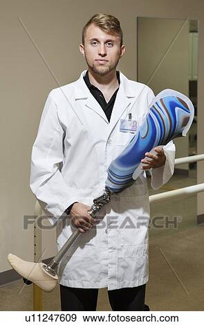 Portrait of a young technician with advanced prosthetic foot View Large Photo Image Stock Photo - Portrait of a young technician with advanced prosthetic foot. Fotosearch