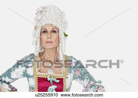 Portrait of confident senior queen over gray background View Large Photo Image Stock Image - Portrait of confident senior queen over gray background. Fotosearch