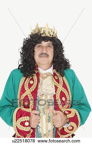 Stock Photo - Portrait of senior king with royal crown over gray background. Fotosearch
