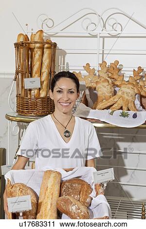 Portrait of woman in bakery with fresh breads View Large Photo Image Stock Image - Portrait of woman in bakery with fresh breads. Fotosearch