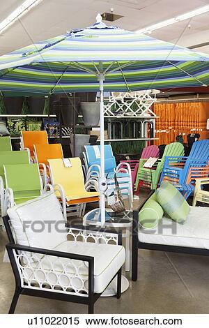 Seating furniture and patio umbrella for sale in garden furniture store View Large Photo Image Stock Photography - Seating furniture and patio umbrella for sale in garden furniture store. Fotosearch