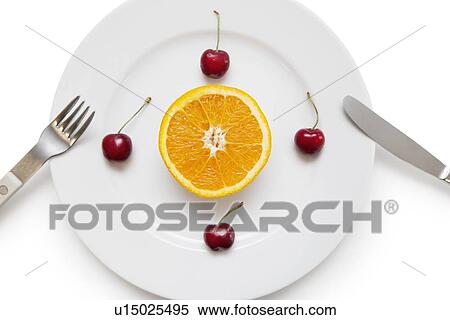 Sliced orange and cherries arranged in a plate with fork and knife over white background View Large Photo Image Stock Photography - Sliced orange and cherries arranged in a plate with fork and knife over white background. Fotosearch
