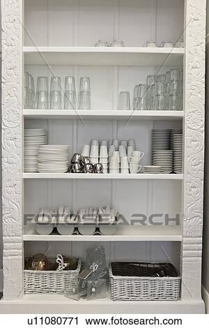 Tableware arranged in shelf View Large Photo Image Stock Image - Tableware arranged in shelf. Fotosearch