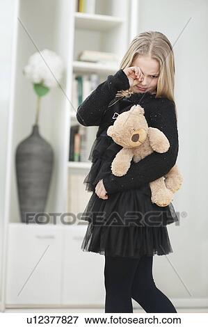Unhappy little girl crying View Large Photo Image Stock Photo - Unhappy little girl crying. Fotosearch