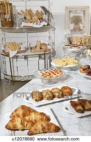 Varieties of fresh breads and sweet food at bakery View Large Photo Image Stock Image - Varieties of fresh breads and sweet food at bakery. Fotosearch