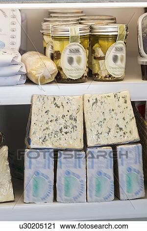 Variety of cheese blocks and jars on shelf View Large Photo Image Stock Image - Variety of cheese blocks and jars on shelf. Fotosearch