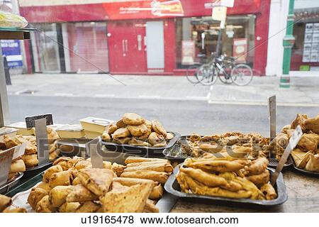 Variety of Indian food in tray for sale View Large Photo Image Stock Photo - Variety of Indian food in tray for sale. Fotosearch