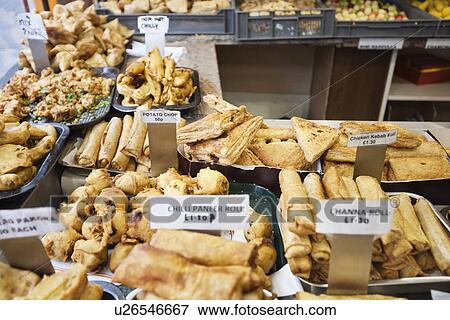 Variety of Indian food on sale View Large Photo Image Stock Photo - Variety of Indian food on sale. Fotosearch