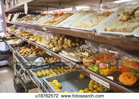 Variety of Indian sweets displayed at store View Large Photo Image Stock Image - Variety of Indian sweets displayed at store. Fotosearch