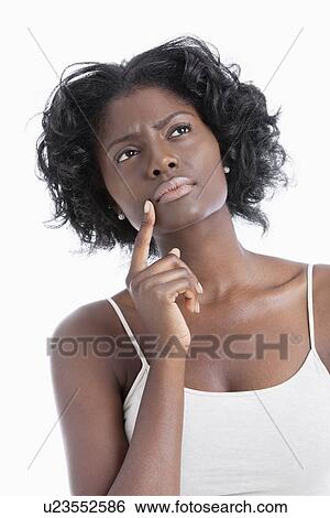 African American young woman looking away while thinking over white background View Large Photo Image Stock Photograph - African American young woman looking away while thinking over white background. Fotosearch