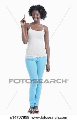 African American young woman pointing her index finger upwards over white background View Large Photo Image Stock Photo - African American young woman pointing her index finger upwards over white background. Fotosearch
