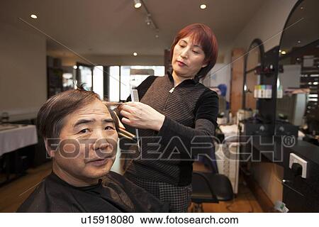 Close-up of Female Korean Hair Dresser Cutting Male customers hair View Large Photo Image Stock Image - Close-up of Female Korean Hair Dresser Cutting Male customers hair. Fotosearch