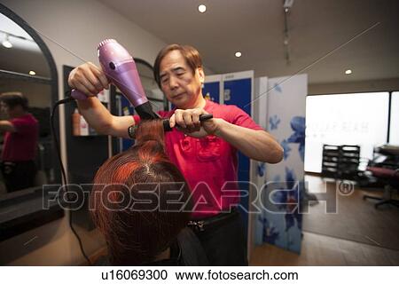 Close-up of Male Korean Hair Dresser Blow drying Female customers hair View Large Photo Image Stock Image - Close-up of Male Korean Hair Dresser Blow drying Female customers hair. Fotosearch