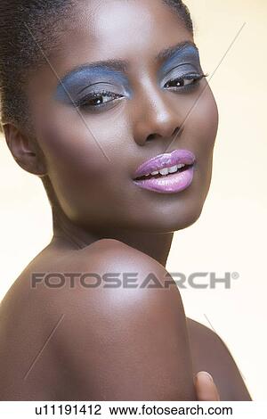 Stock Image - Close-up view of beautiful woman wearing make-up. Fotosearch