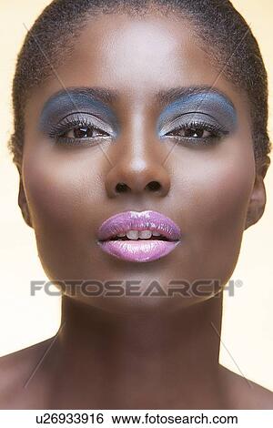 Stock Photograph - Close-up view of beautiful woman wearing make-up. Fotosearch