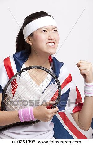 Female tennis player with British flag celebrating success against white background View Large Photo Image Stock Photograph - Female tennis player with British flag celebrating success against white background. Fotosearch