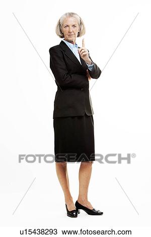 Stock Image - Full length shot of senior business woman indicating that she in Number 1. Fotosearch