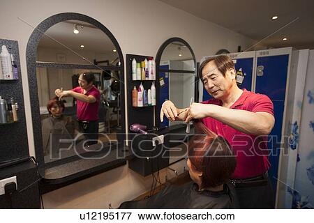 Male Korean Hair Dresser cuts Female customers hair View Large Photo Image Stock Photo - Male Korean Hair Dresser cuts Female customers hair. Fotosearch