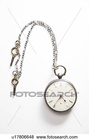 Old-fashioned pocket watch over white background View Large Photo Image Stock Photo - Old-fashioned pocket watch over white background. Fotosearch