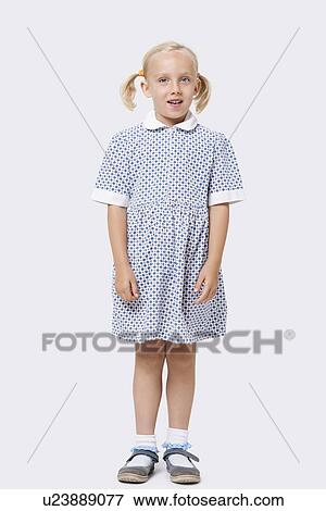 Portrait of a little girl standing over white background View Large Photo Image Stock Photo - Portrait of a little girl standing over white background. Fotosearch