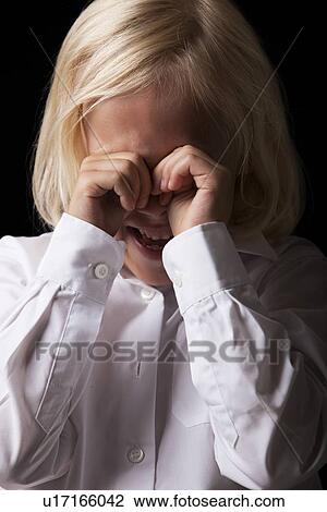 Portrait of a young girl crying on a black background View Large Photo Image Stock Image - Portrait of a young girl crying on a black background. Fotosearch