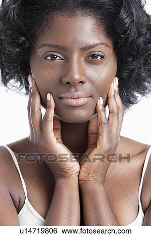 Portrait of an African American young woman with hands on face View Large Photo Image Stock Photograph - Portrait of an African American young woman with hands on face. Fotosearch