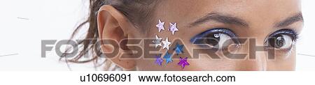 Portrait of beautiful young woman with stars on her face against white background View Large Photo Image Stock Image - Portrait of beautiful young woman with stars on her face against white background. Fotosearch