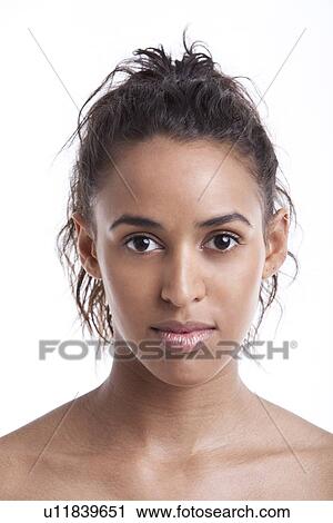 Portrait of young Mixed Race woman against white background View Large Photo Image Stock Image - Portrait of young Mixed Race woman against white background. Fotosearch