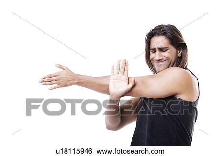 Portrait of young muscular man stretching his arms over white background View Large Photo Image Stock Photograph - Portrait of young muscular man stretching his arms over white background. Fotosearch
