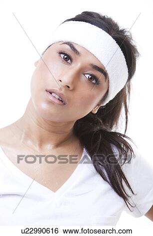 Portrait of young sportswoman over white background View Large Photo Image Stock Photograph - Portrait of young sportswoman over white background. Fotosearch