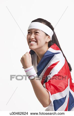 Successful female tennis player with British flag against white background View Large Photo Image Picture - Successful female tennis player with British flag against white background. Fotosearch