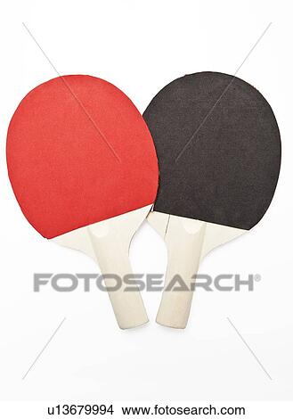 Picture - Two table tennis paddles over white background. Fotosearch