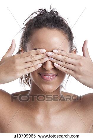Young Mixed Race woman covering her eyes with hands against white background View Large Photo Image Stock Photography - Young Mixed Race woman covering her eyes with hands against white background. Fotosearch
