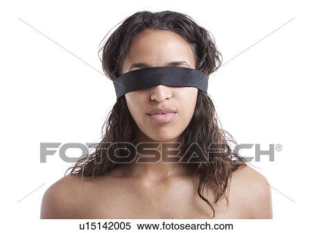 Young Mixed Race woman wearing blindfold against white background View Large Photo Image Stock Photography - Young Mixed Race woman wearing blindfold against white background. Fotosearch