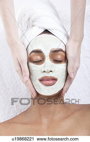 Young woman receiving facial treatment at spa View Large Photo Image Stock Image - Young woman receiving facial treatment at spa. Fotosearch