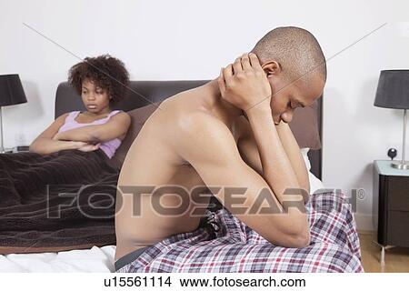 African American couple in bedroom ignoring each other View Large Photo Image Picture - African American couple in bedroom ignoring each other. Fotosearch