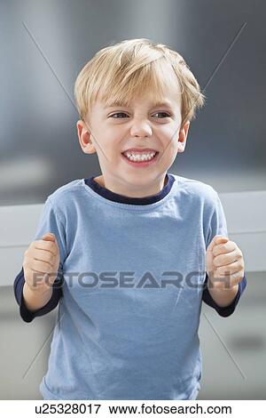 Angry Caucasian boy in sleepwear clenching his teeth View Large Photo Image Stock Photo - Angry Caucasian boy in sleepwear clenching his teeth. Fotosearch