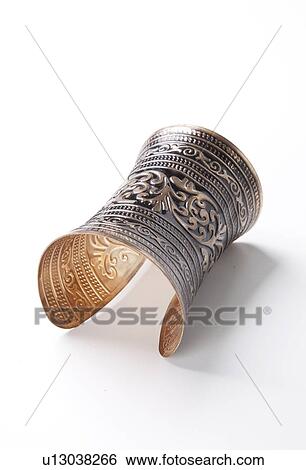 Stock Photograph - Beautiful design on bracelet over white background. Fotosearch