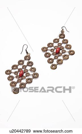 Beautiful diamond shape earrings over white background View Large Photo Image Stock Photo - Beautiful diamond shape earrings over white background. Fotosearch