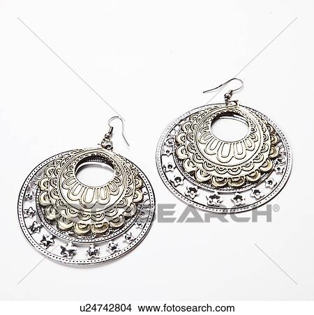 Beautiful traditional earrings over white background View Large Photo Image Picture - Beautiful traditional earrings over white background. Fotosearch