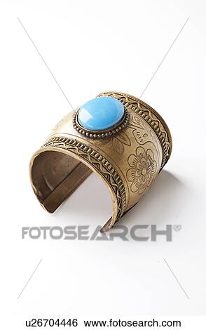 Blue gem on traditional bracelet over white background View Large Photo Image Stock Photograph - Blue gem on traditional bracelet over white background. Fotosearch